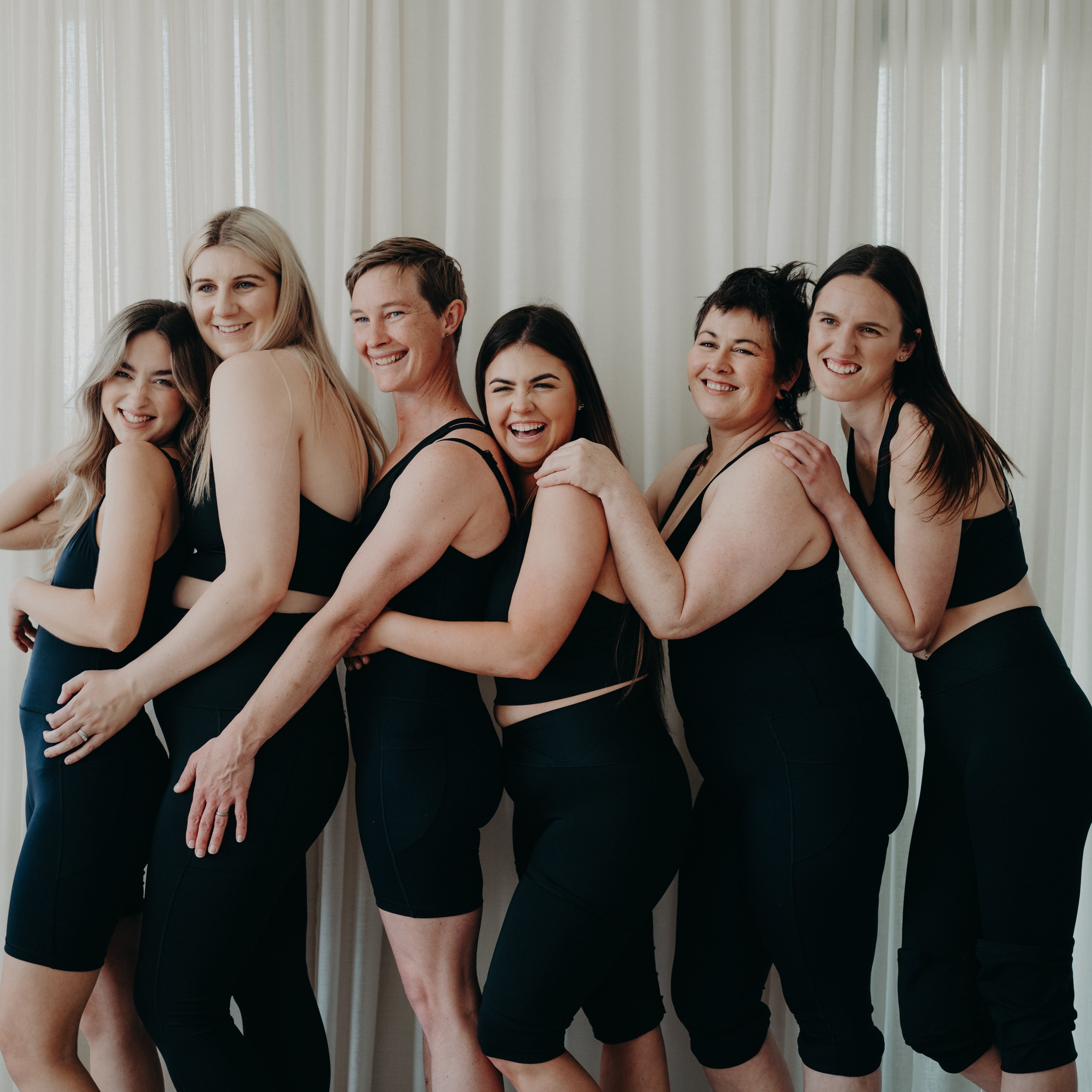 Women laughing in activewear