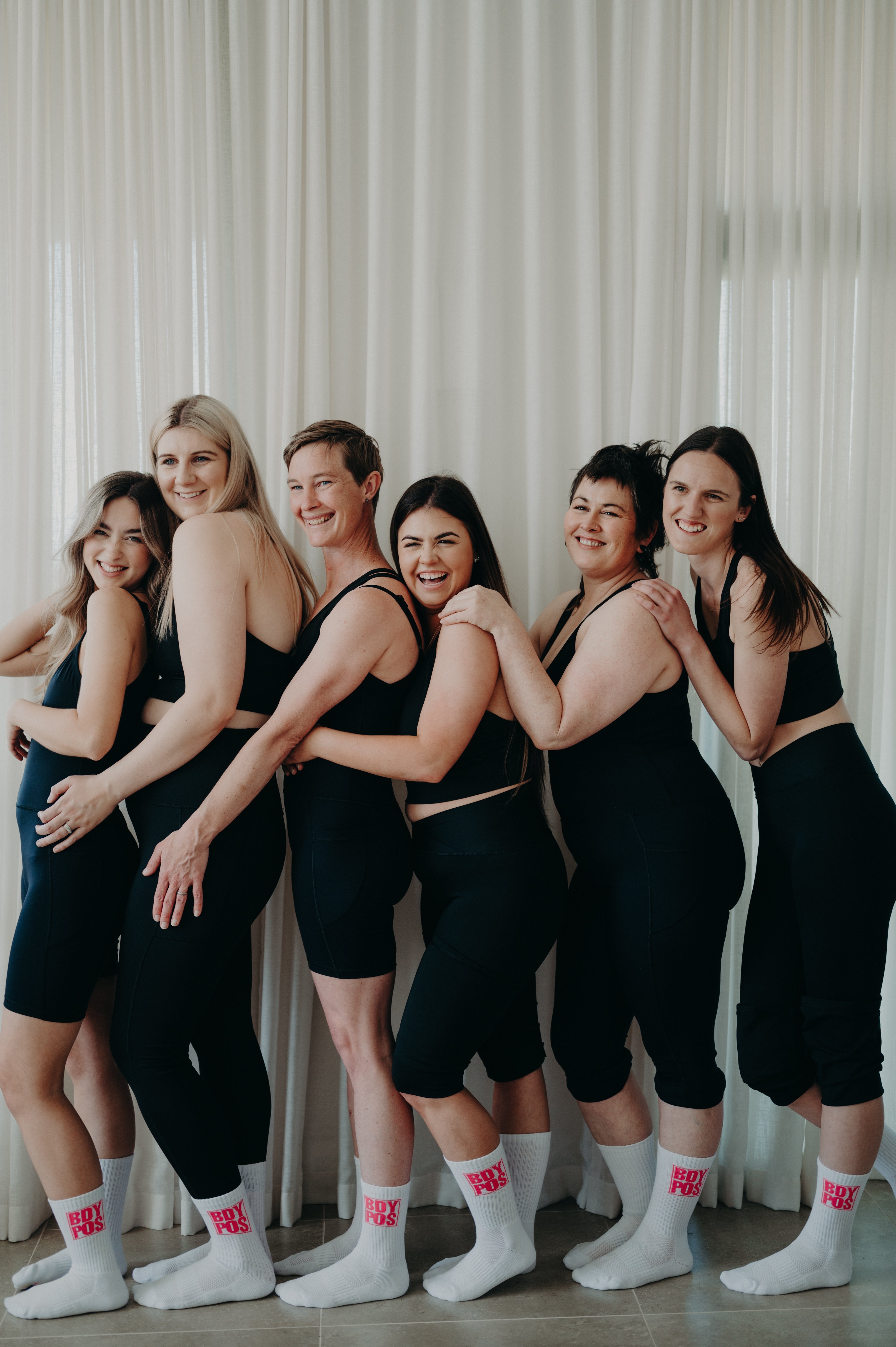 Women laughing in activewear